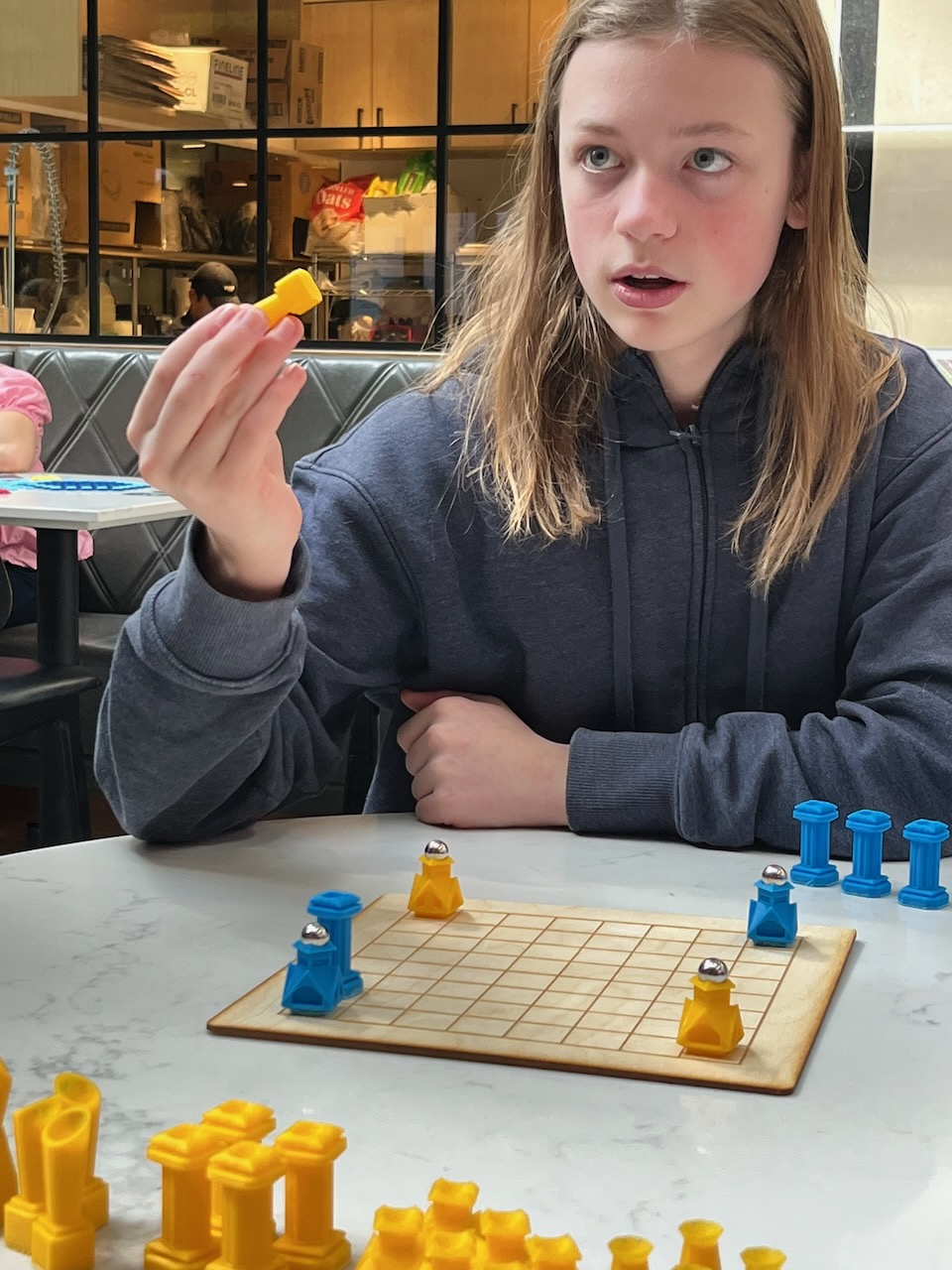 Keegan Franck explaining Rendezvous during play testing.
